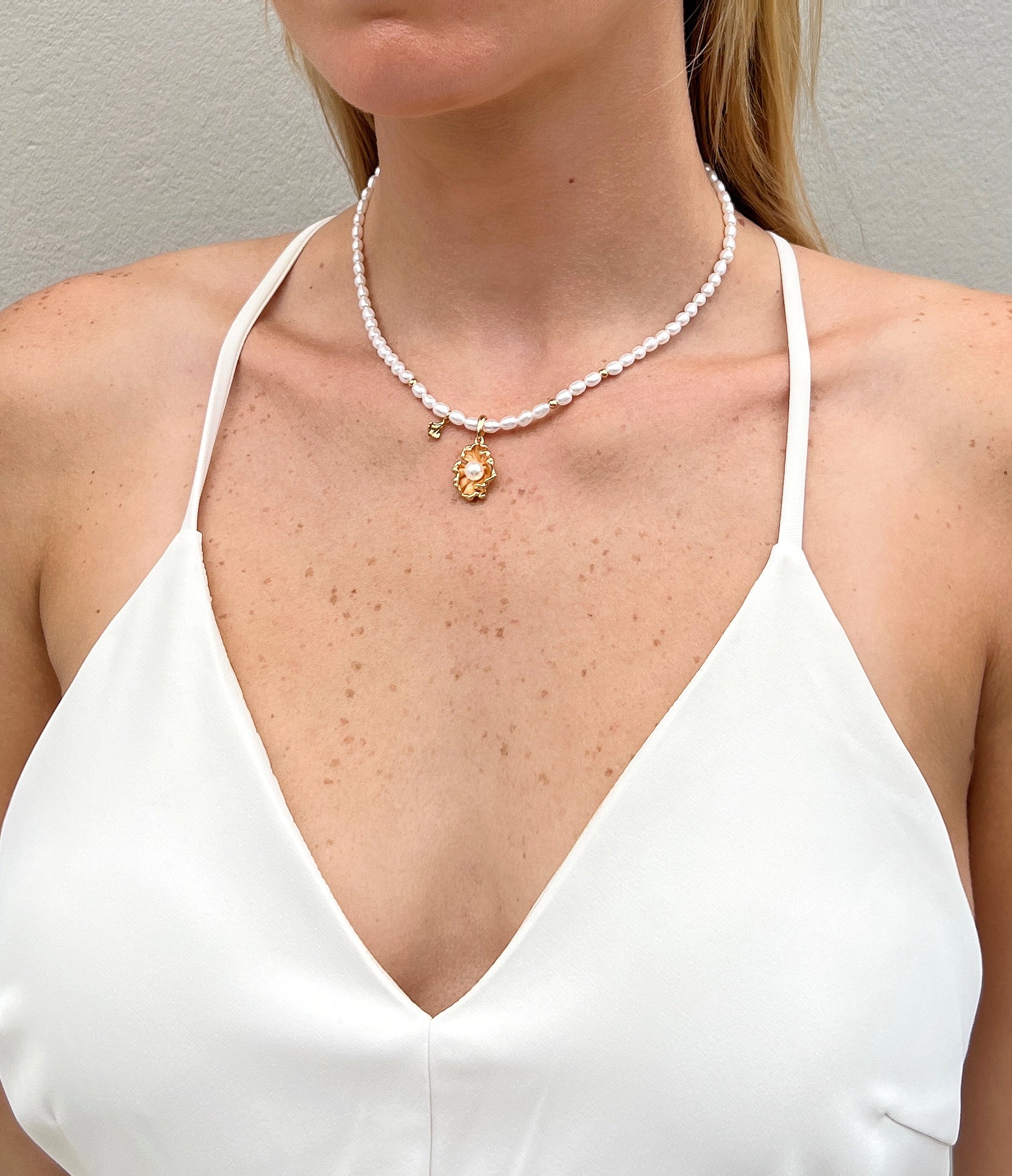 18k gold and freshwater pearl necklace on model