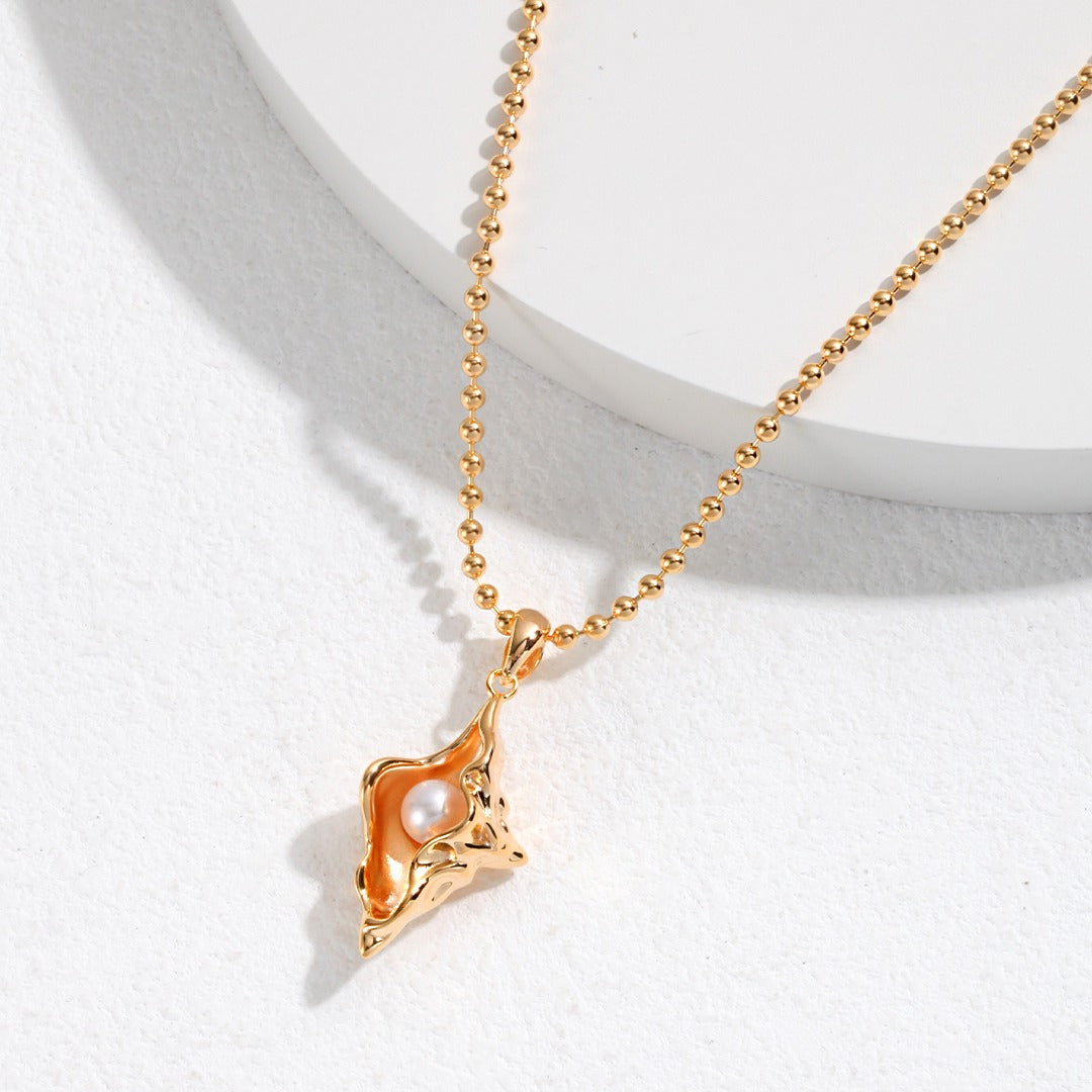golden conch necklace apelila jewelry