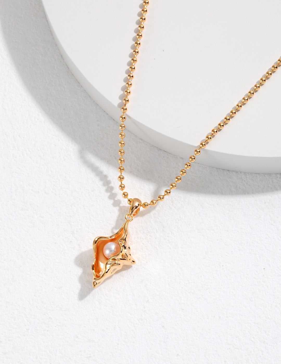 golden conch necklace apelila jewelry