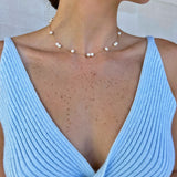 18k gold and pearl necklace on model